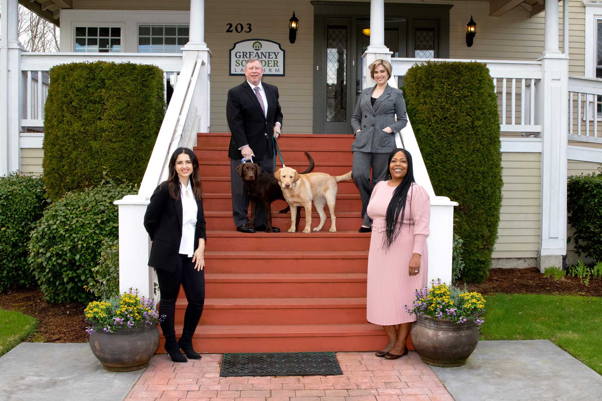 gslawbanner greaney scudder law team standing on the office stairs